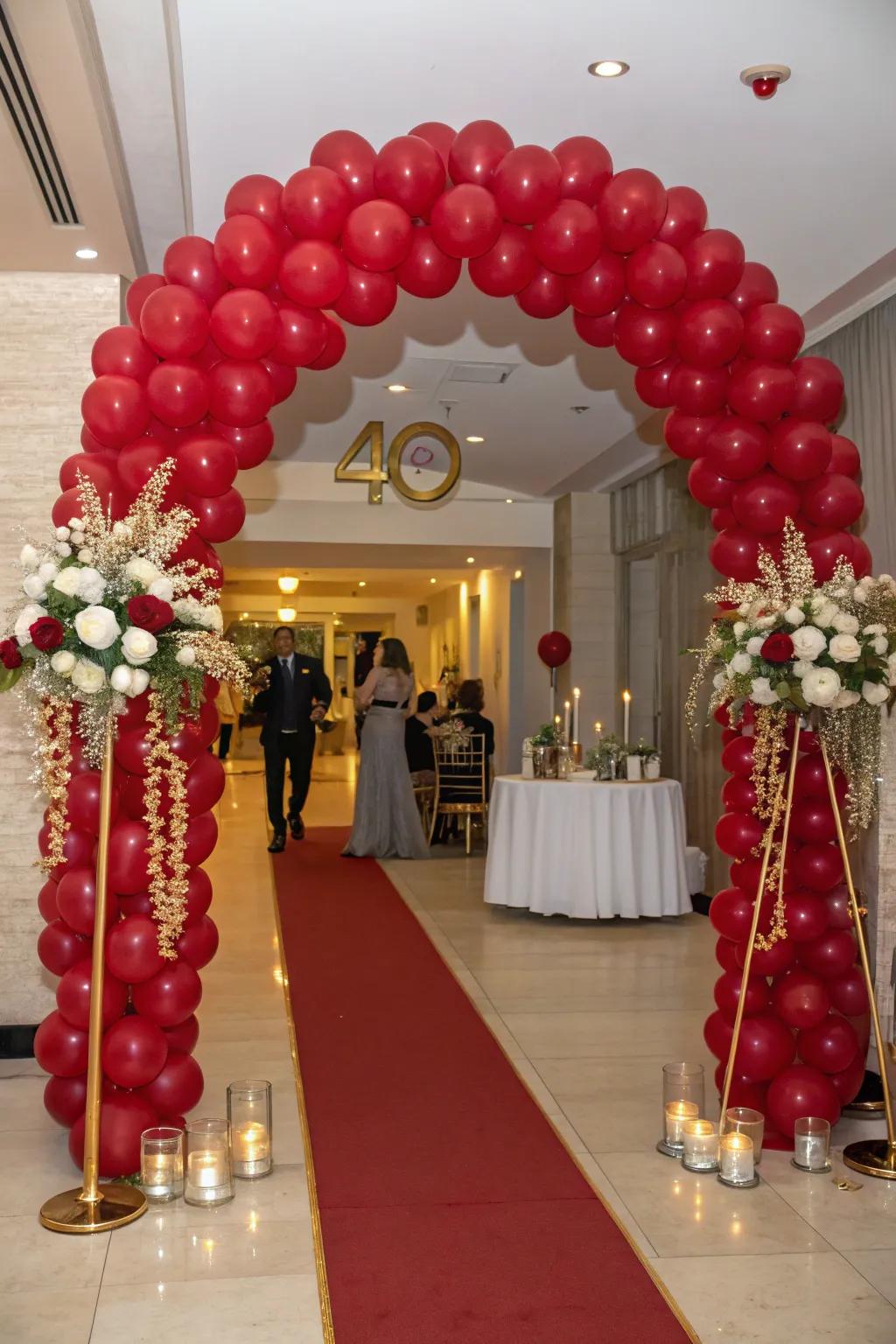 A ruby-themed balloon arch crafts a magnificent entrance.