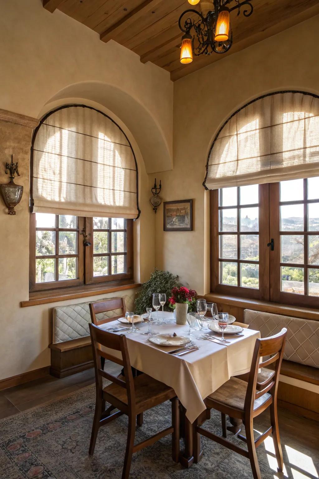 Cozy dining room featuring pleated shades on arched windows.