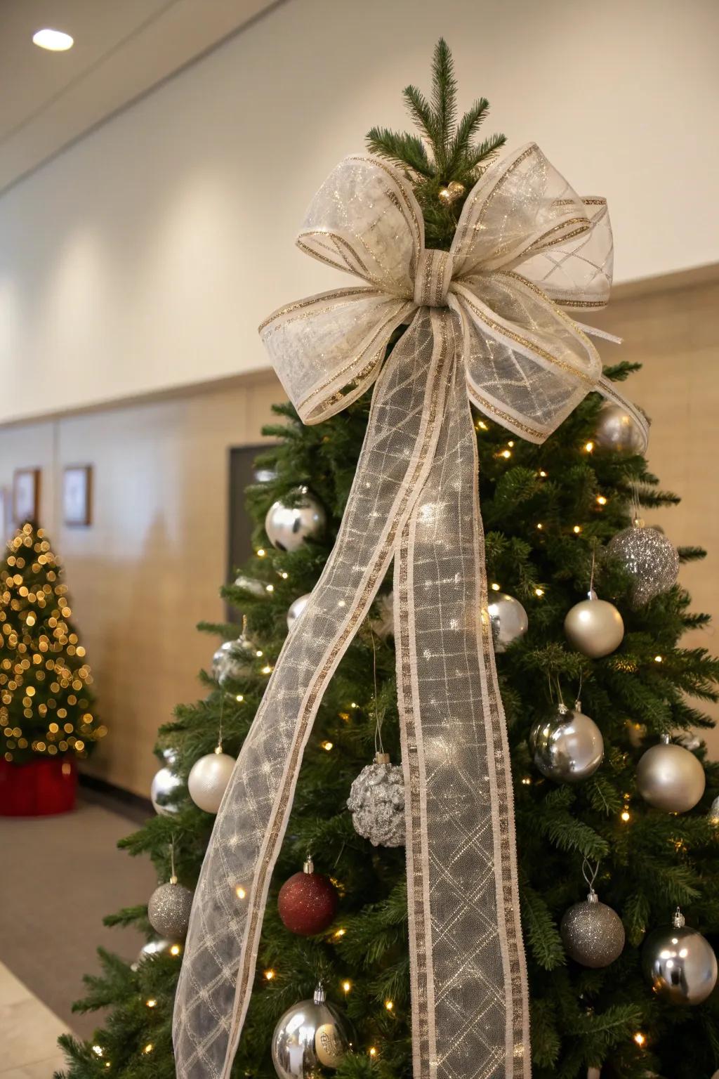 A Christmas tree topped with a grand bow, contributing a traditional aspect to the festive embellishments.