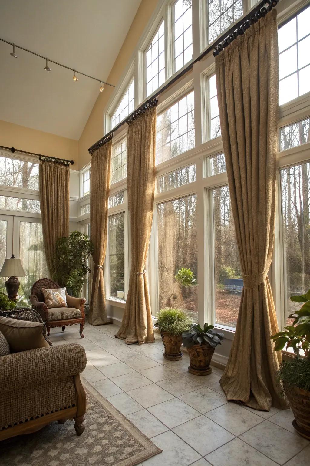 Floor-to-ceiling window coverings bring a sense of majesty to your sunroom.