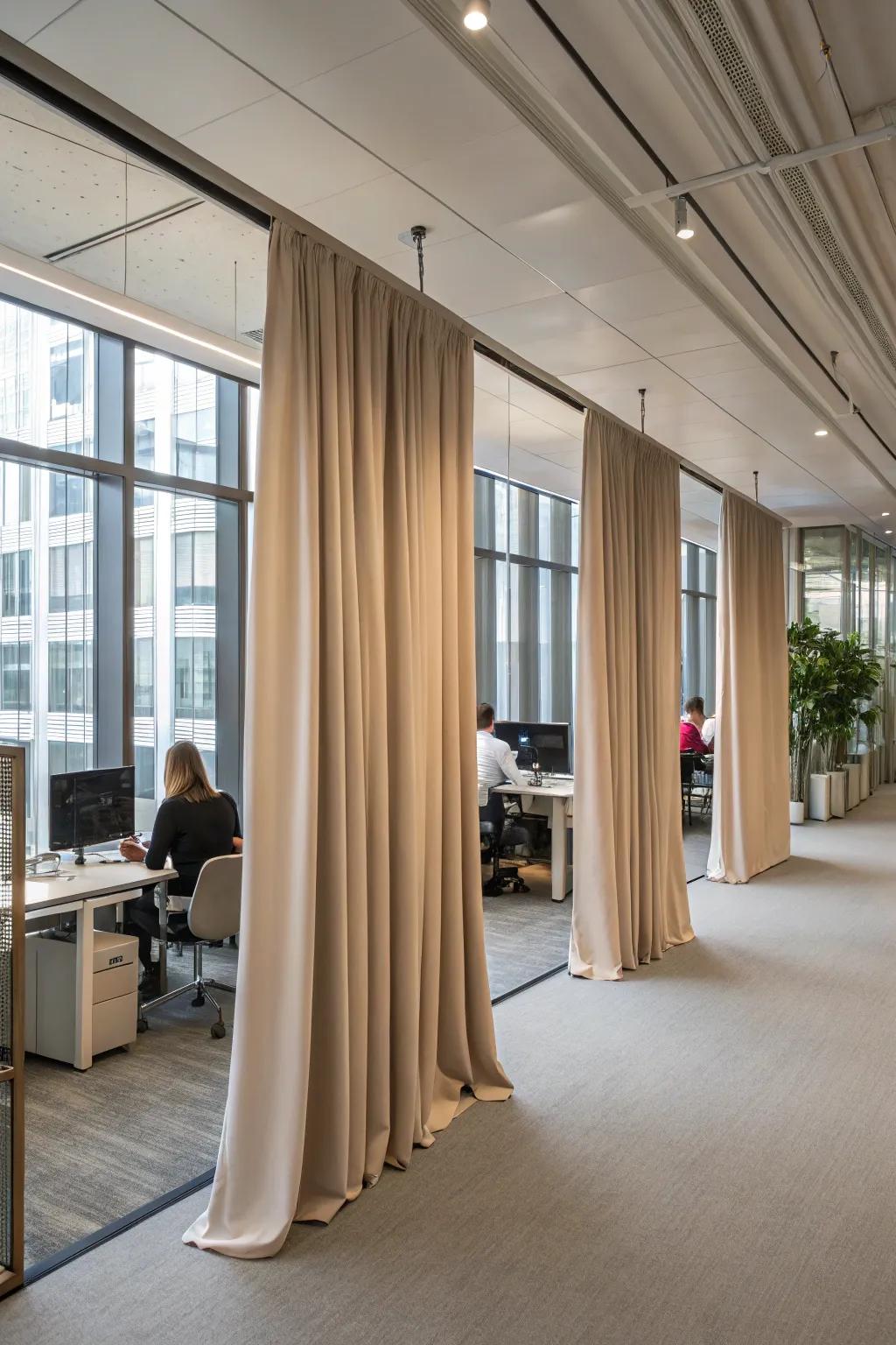 Textile dividers add softness and versatility to office plans.
