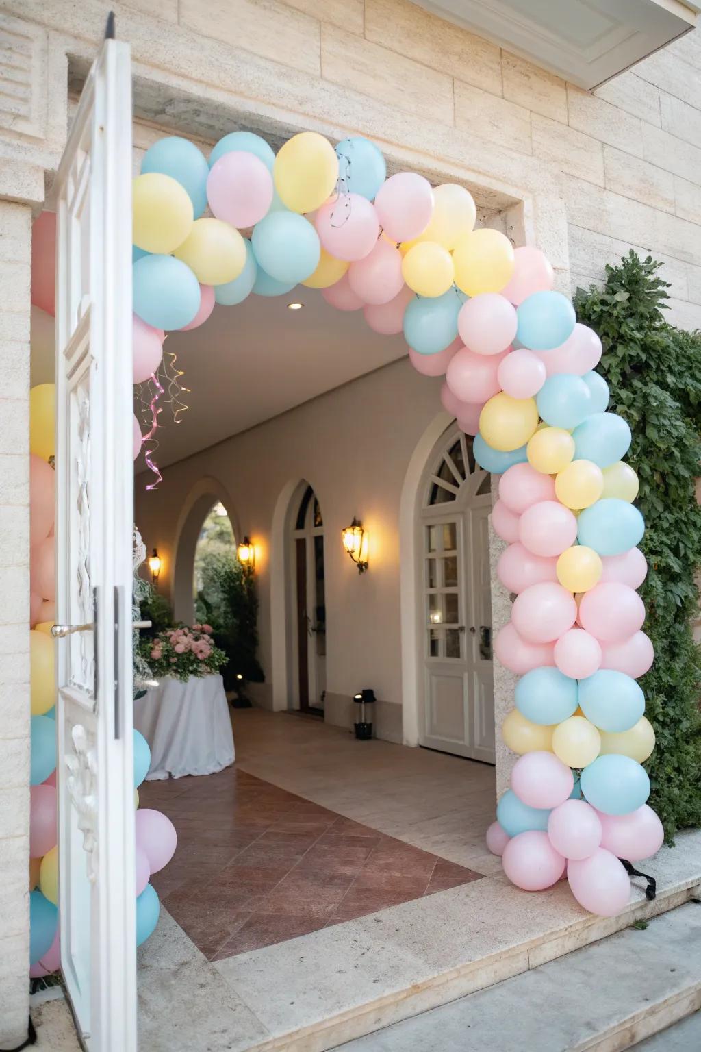 A subtle and elegant balloon arch in soft pastels.