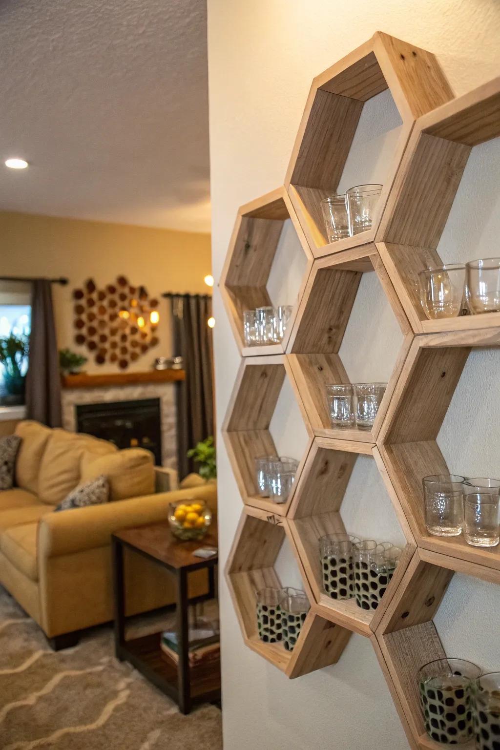 A living room wall featuring hexagonal shelves with shot glasses arranged in a honeycomb pattern.