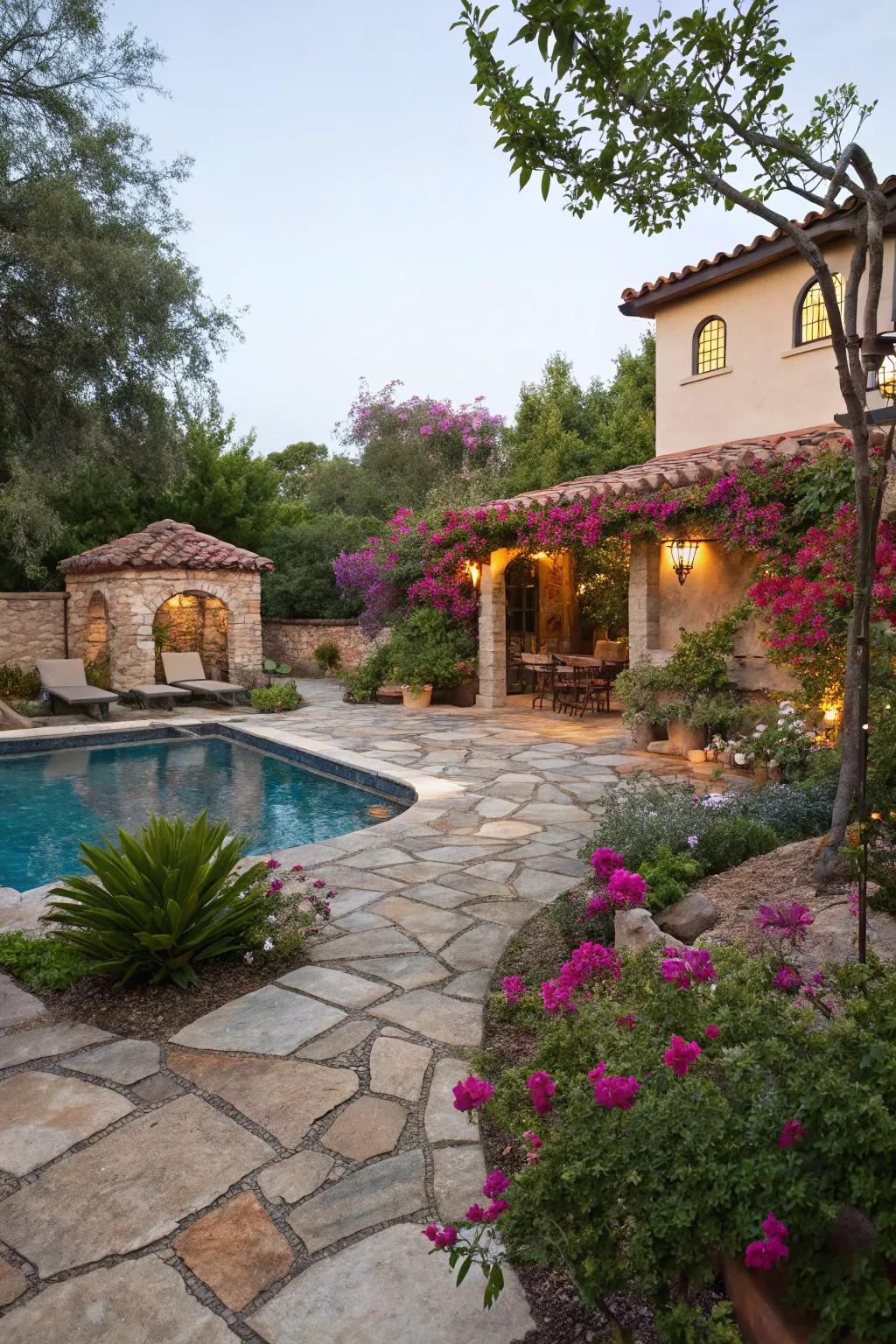 Organic stone ground coverings add a rustic touch to this Spanish-inspired pool space.