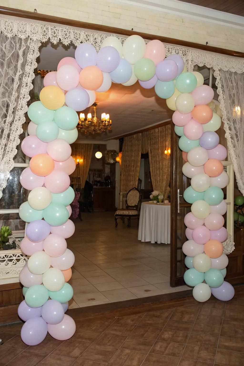 A delightful light hued balloon gateway that greets attendees.