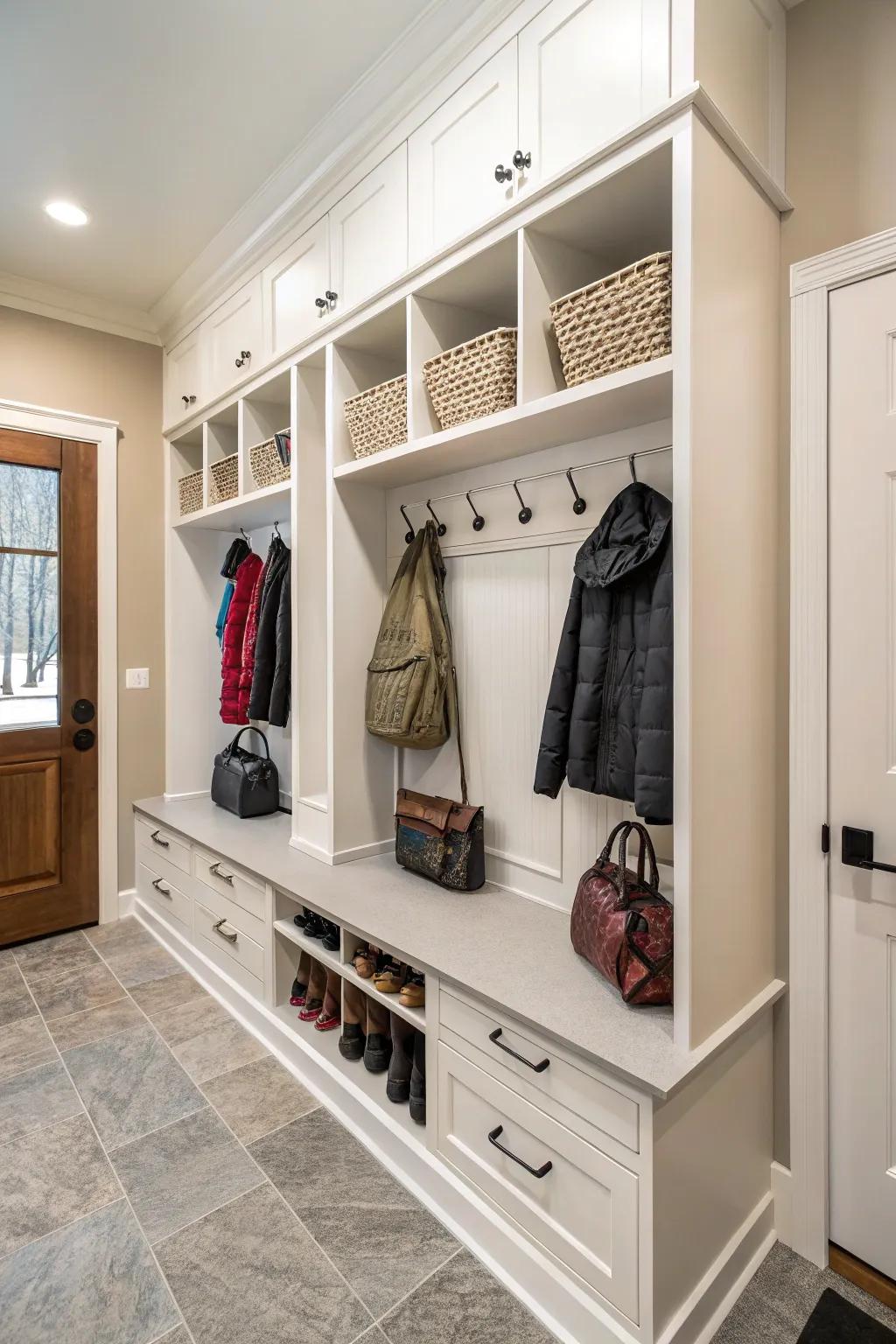 Hooks near cabinets offer convenience for hanging coats and bags.