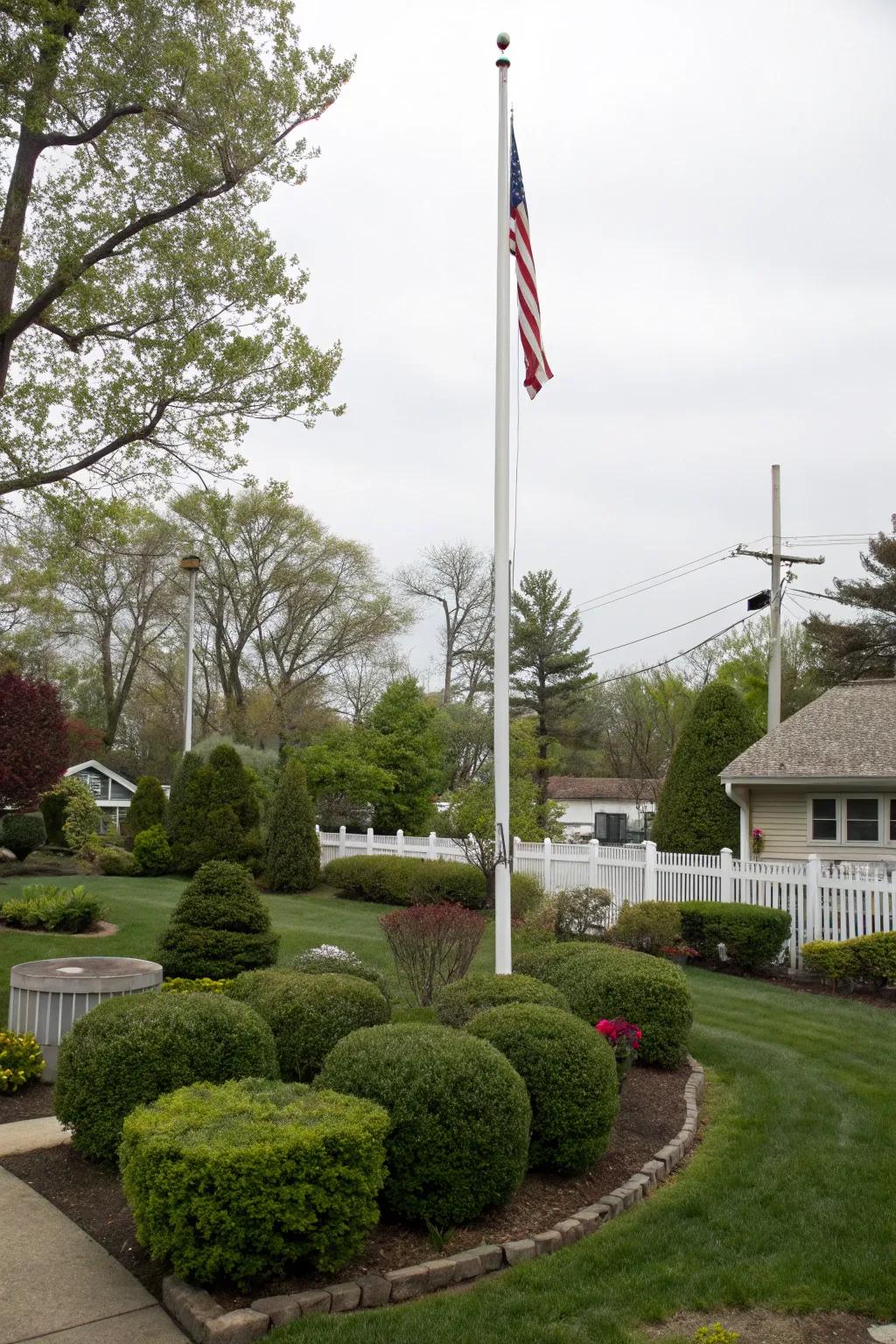 Shrubs and bushes make a rich background for any flagpole.
