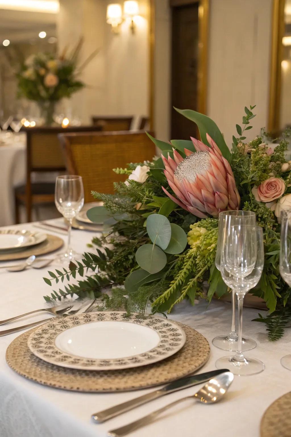 A fusion of blossoms and greenery culminates in a captivating table centerpiece.