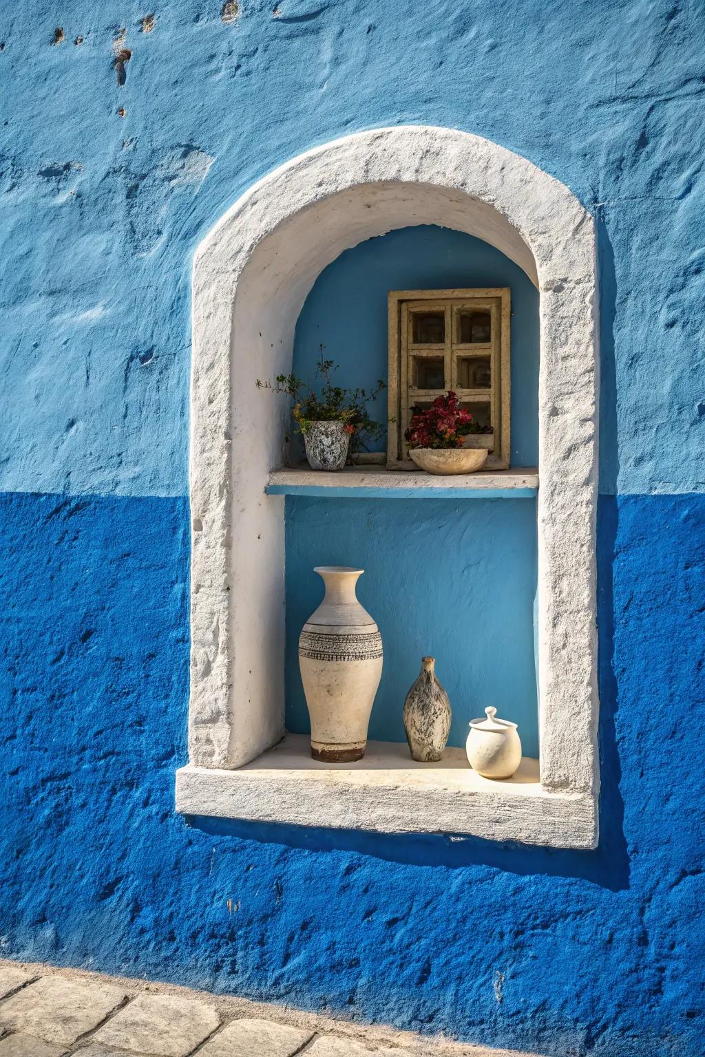 A wall niche painted in a contrasting blue, creating a dramatic focal point.