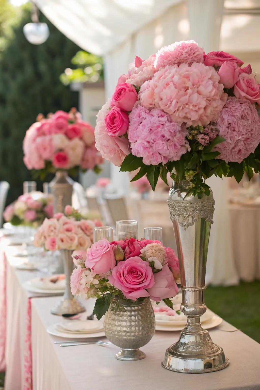 Rosy floral arrangements breathe life and elegance into the party decorations.