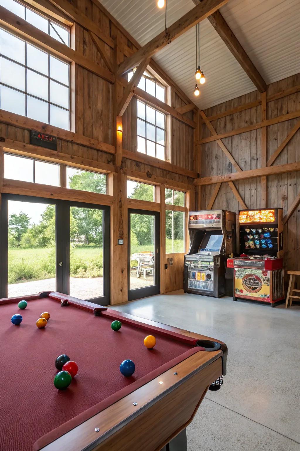 A game room in a pole barn with a pool table and vintage arcade games.