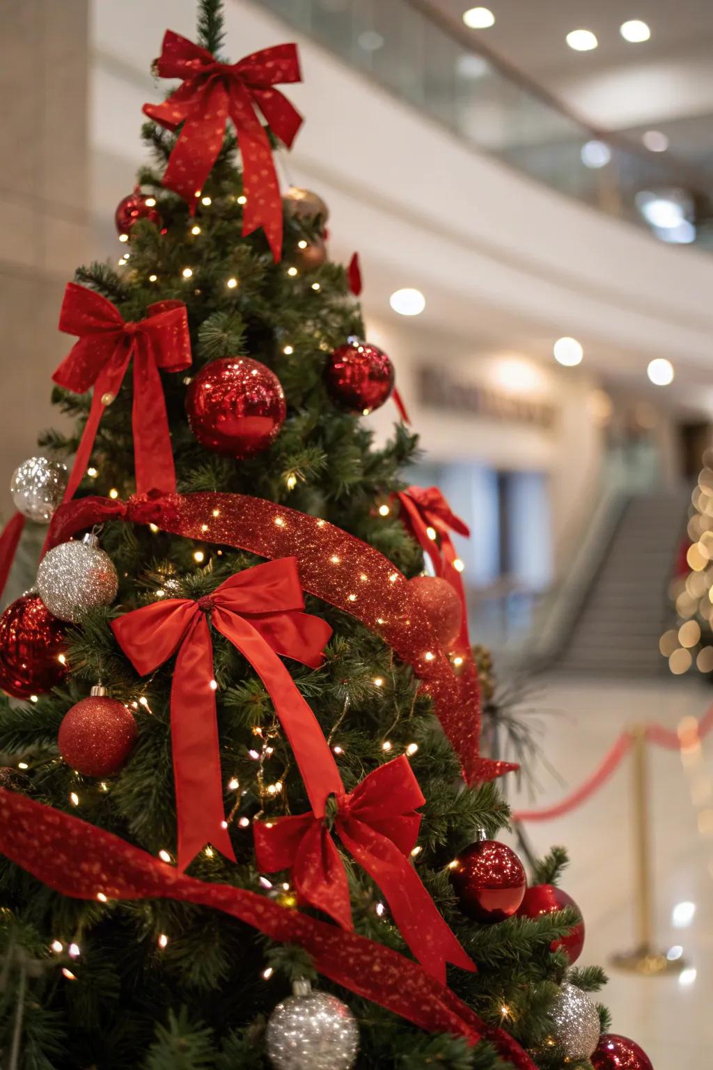 Scarlet ribbons and bows introduce a charming element to the tree.
