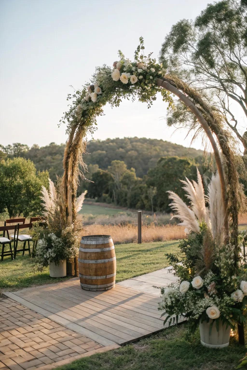 A down-to-earth circular wedding arch featuring pampas plumes and branches.