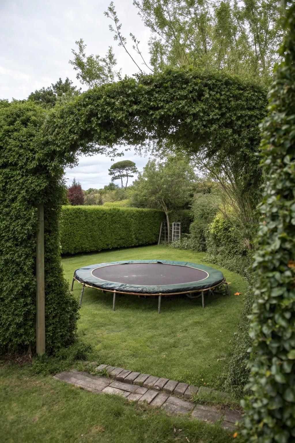 A natural safety barrier of hedges surrounding a bounce bed.