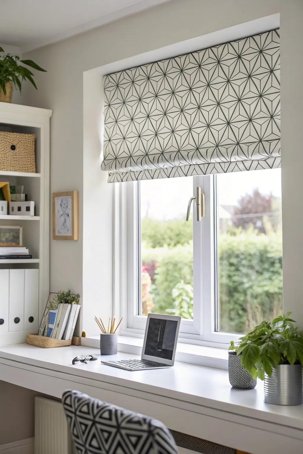 A window with a geometric layout valance in a contemporary home workspace.