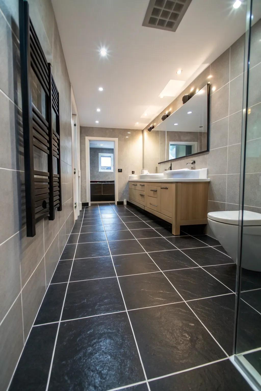 Generously sized dark underlayment create a fluid and expansive look in this bathroom.