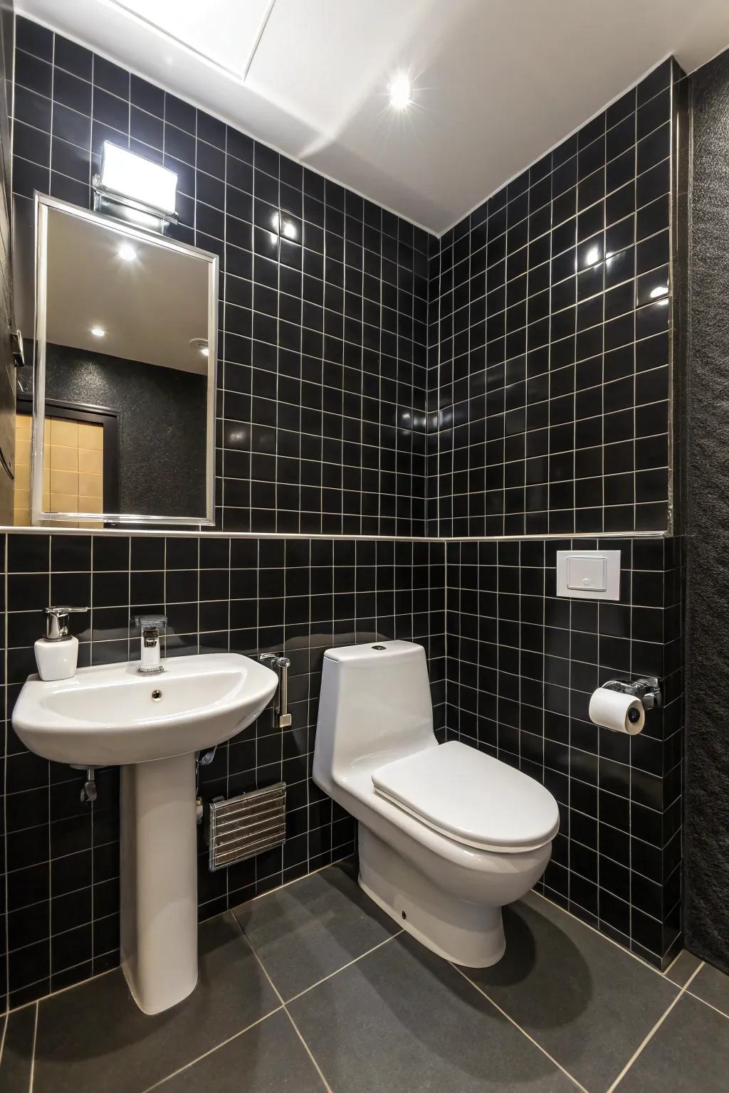 The contrast between black tiles and white elements creates a dynamic bathroom design.