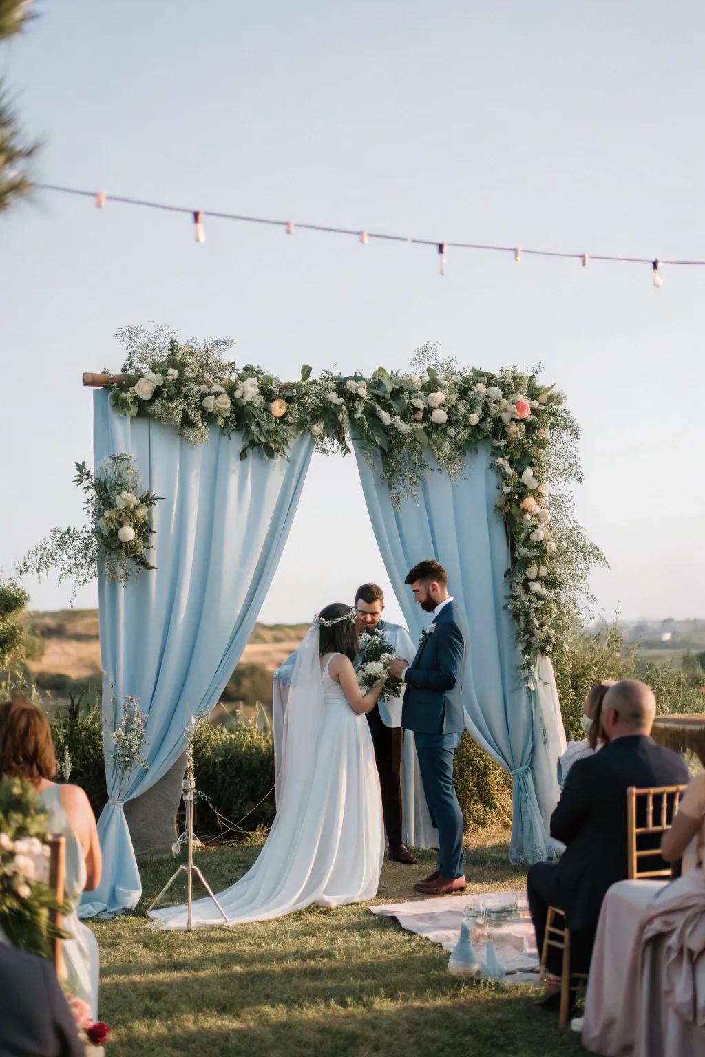 A dreamy ceremony space featuring a sky blue backdrop that enhances the romantic ambiance.