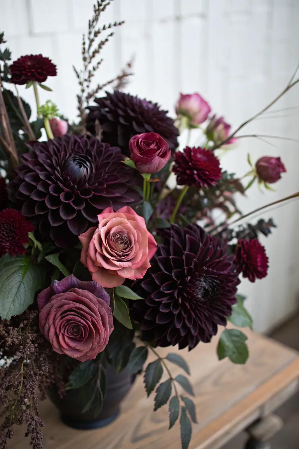 A melancholic bouquet featuring midnight dahlias and plum roses.