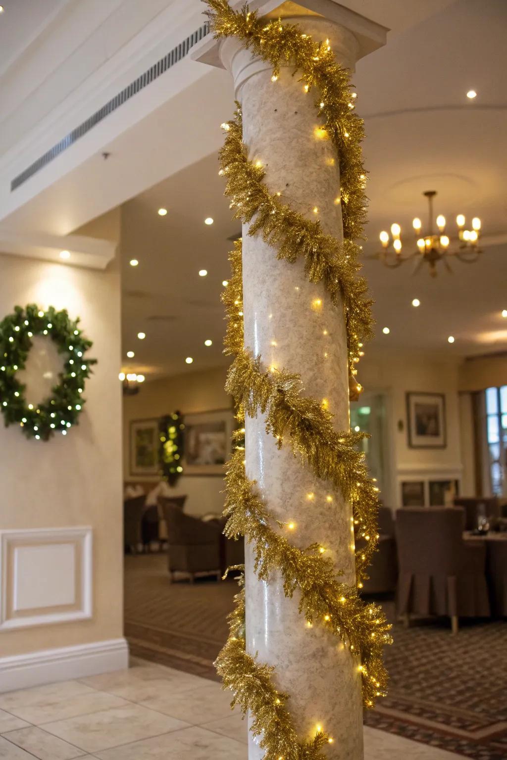 A column wrapped with shimmering gold tinsel garland.