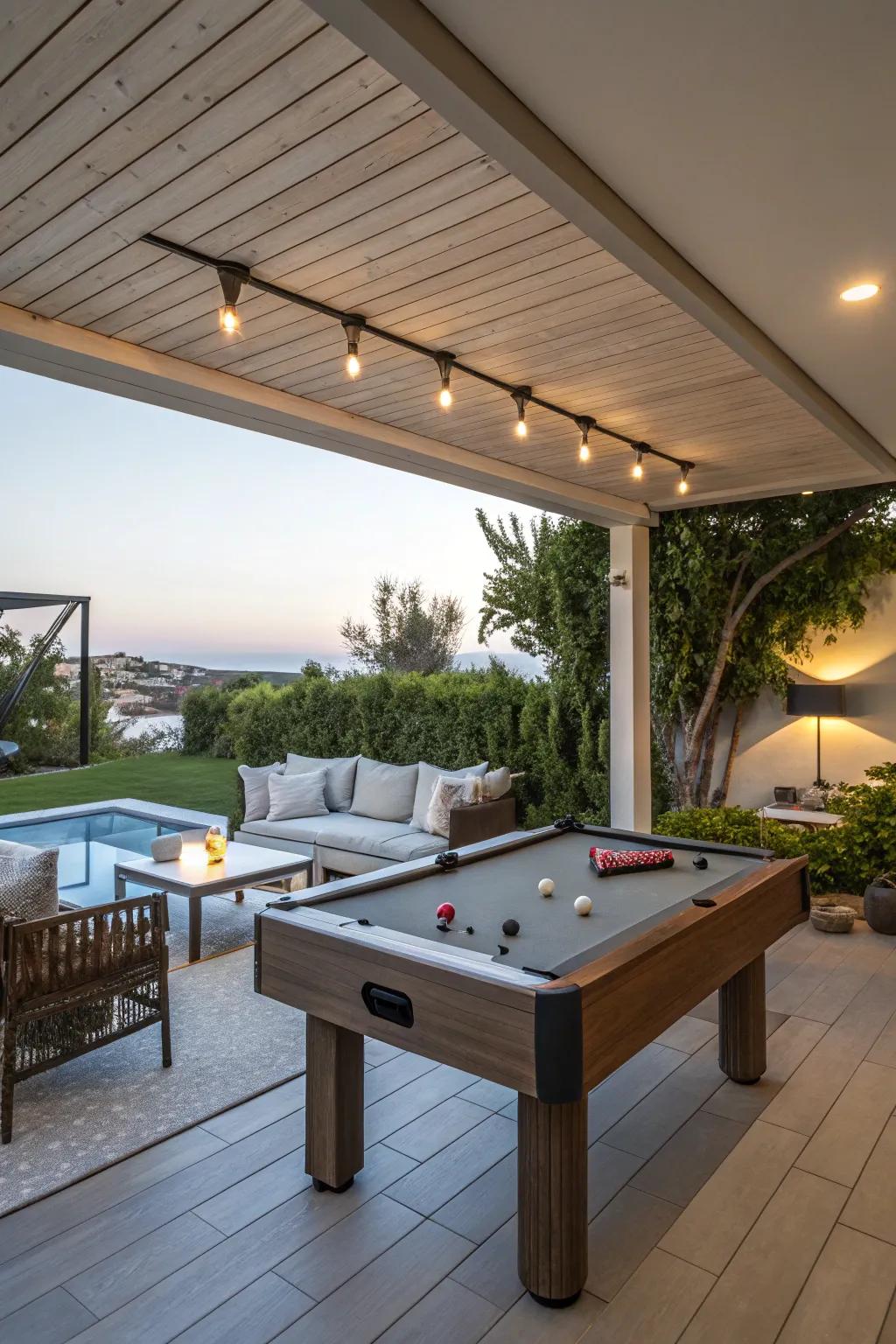 A flexible outdoor area with a pool table and relaxing lounge.
