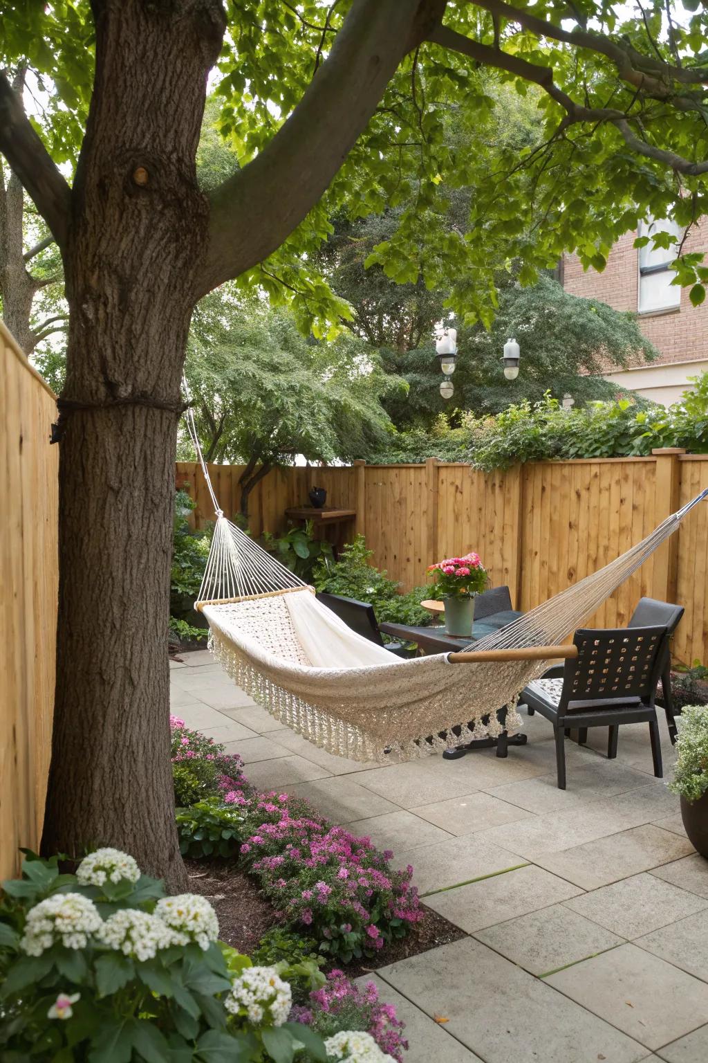 A hammock offering a cozy retreat on a patio shaded by trees.