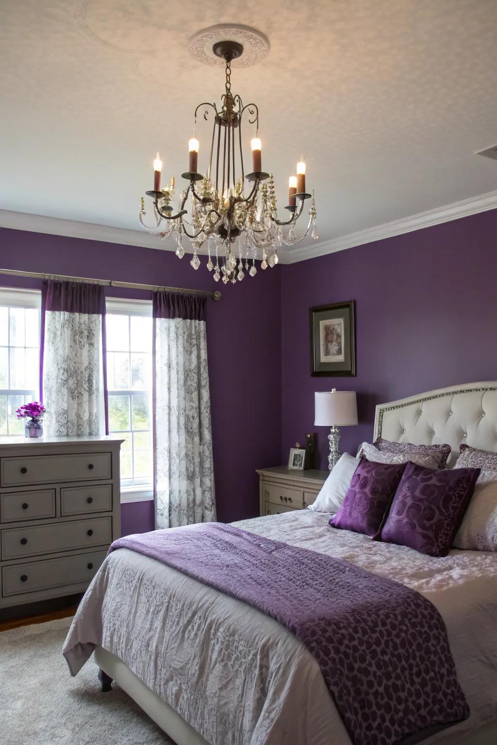 A statement chandelier illuminating purple walls gracefully.