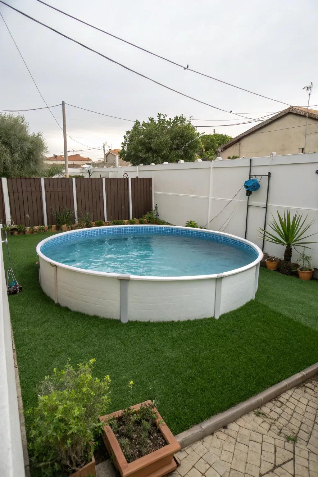 Faux grass creating a vibrant and maintenance-free edge around an above-ground pool.