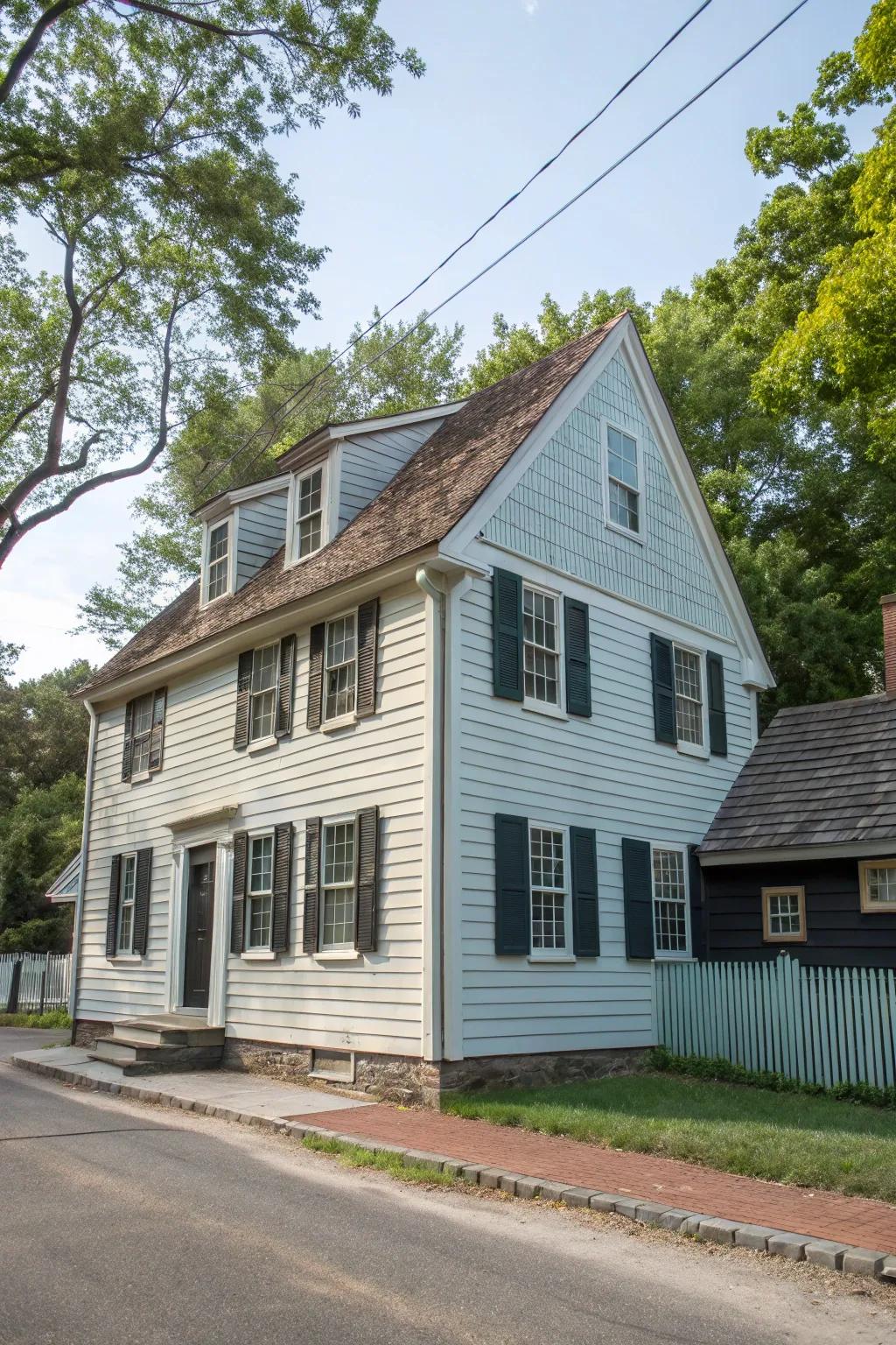 A colonial house showcasing a stylish two-tone facade with siding and cladding.