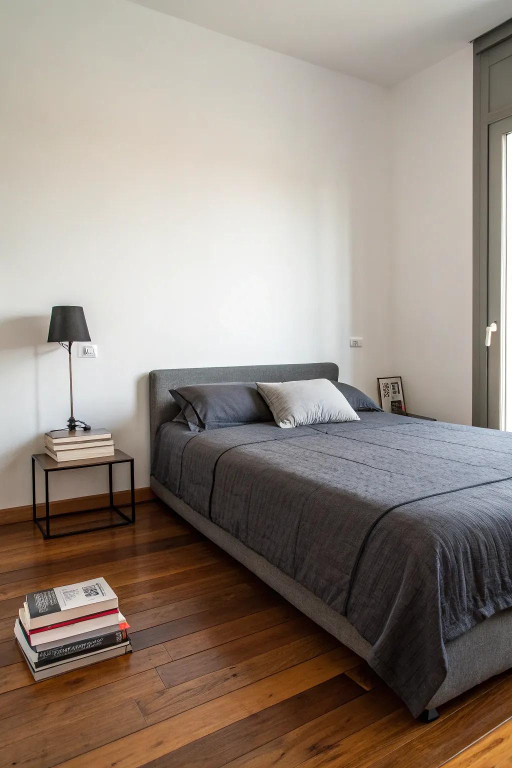 Simplicity and deep charcoal bedding fashion a peaceful sanctuary.