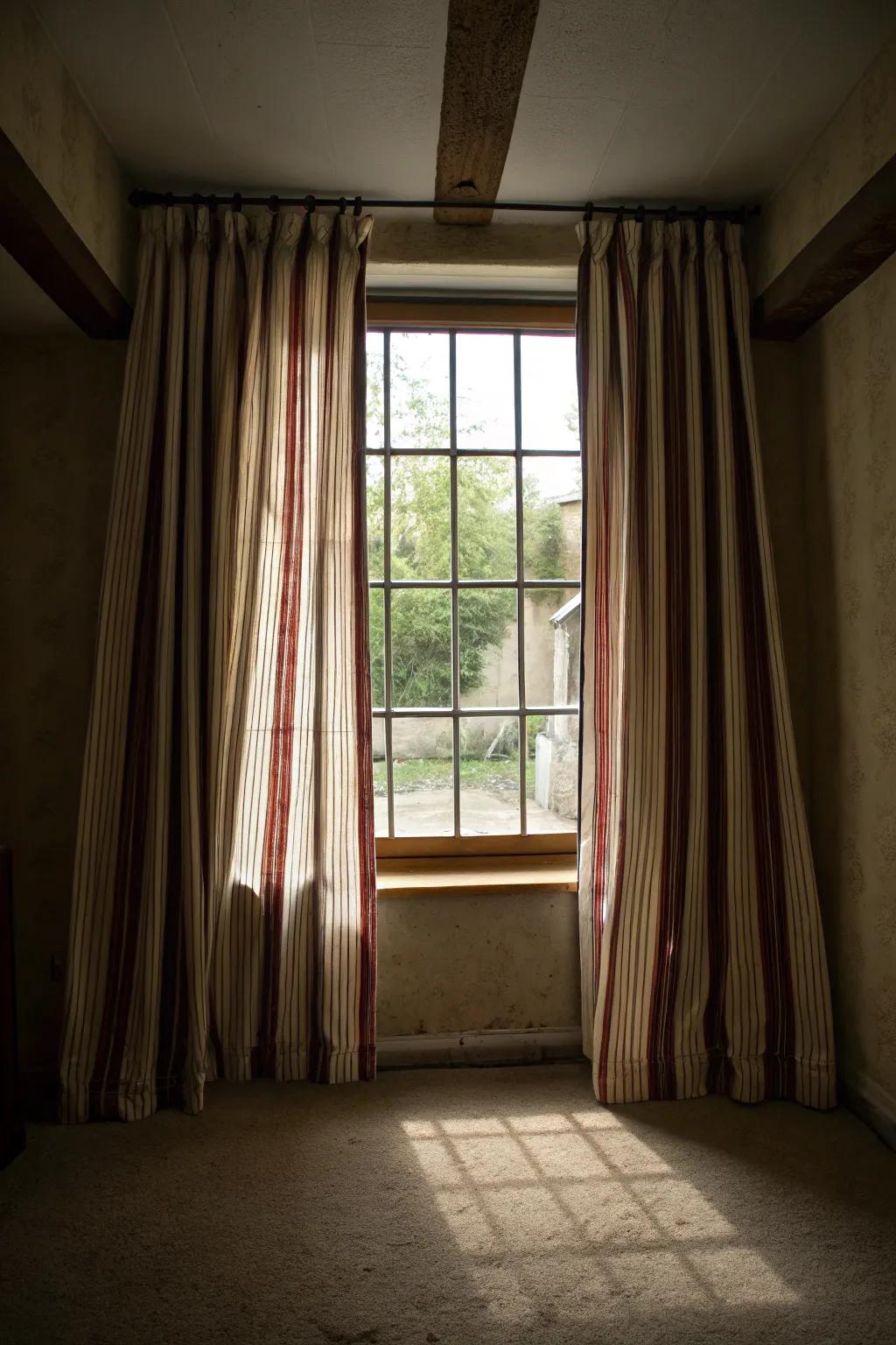 Striped drapes can visually enhance the space.