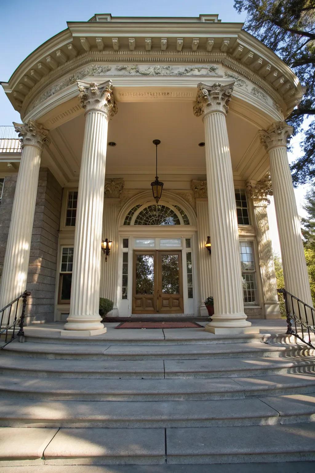 An elegant porch lends grandeur to the entryway.