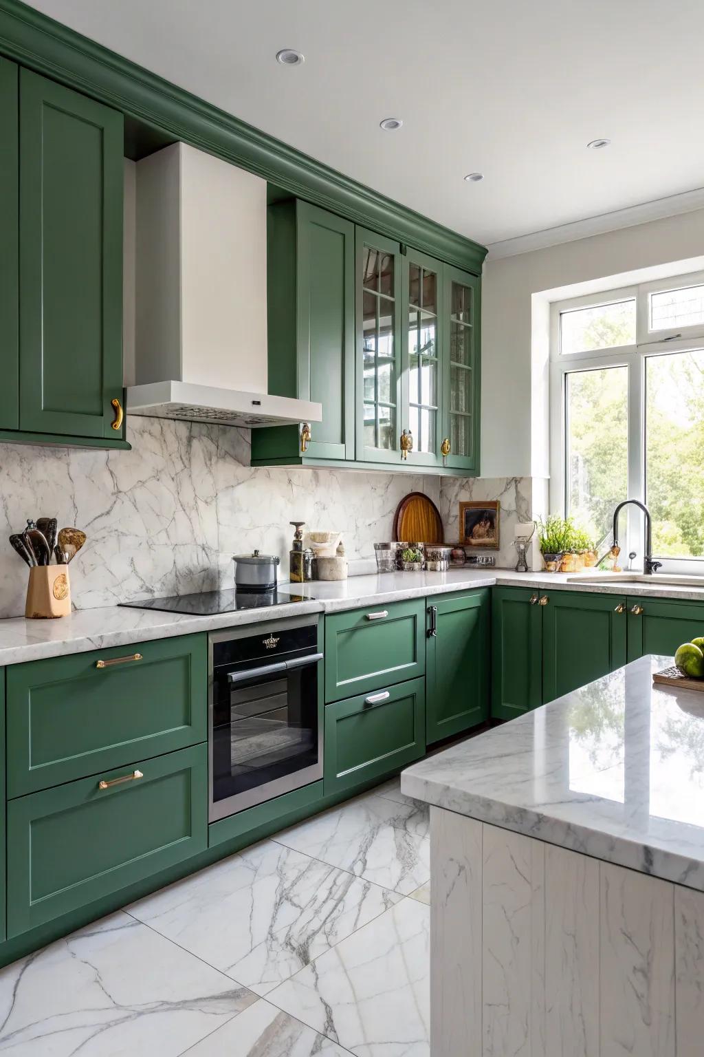 Elegant marble surfaces enhance a green kitchen design.