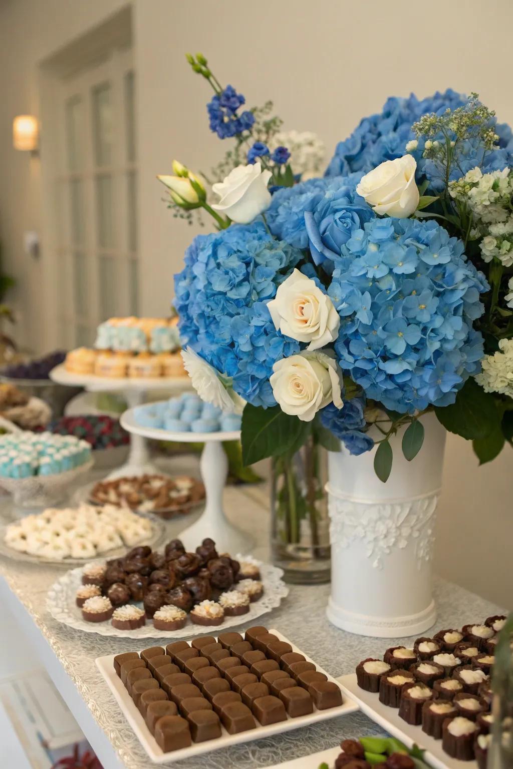 Blue botanical compositions injecting a vibrant, natural detail to the dessert arrangement.