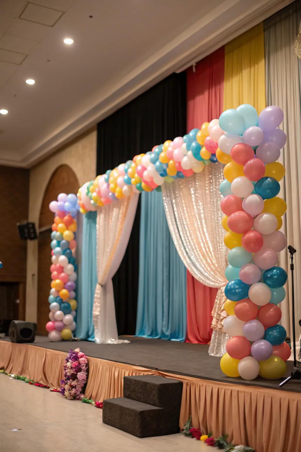 A unified stage design integrating balloons and sophisticated hangings.