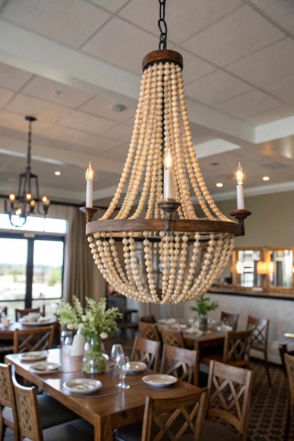 Chandelier elegantly decorated with wood bead garland.