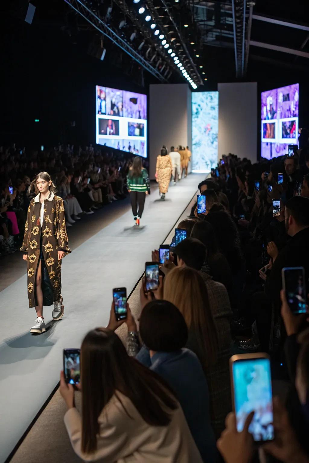 Interactive multimedia displays engage the audience during a fashion show.