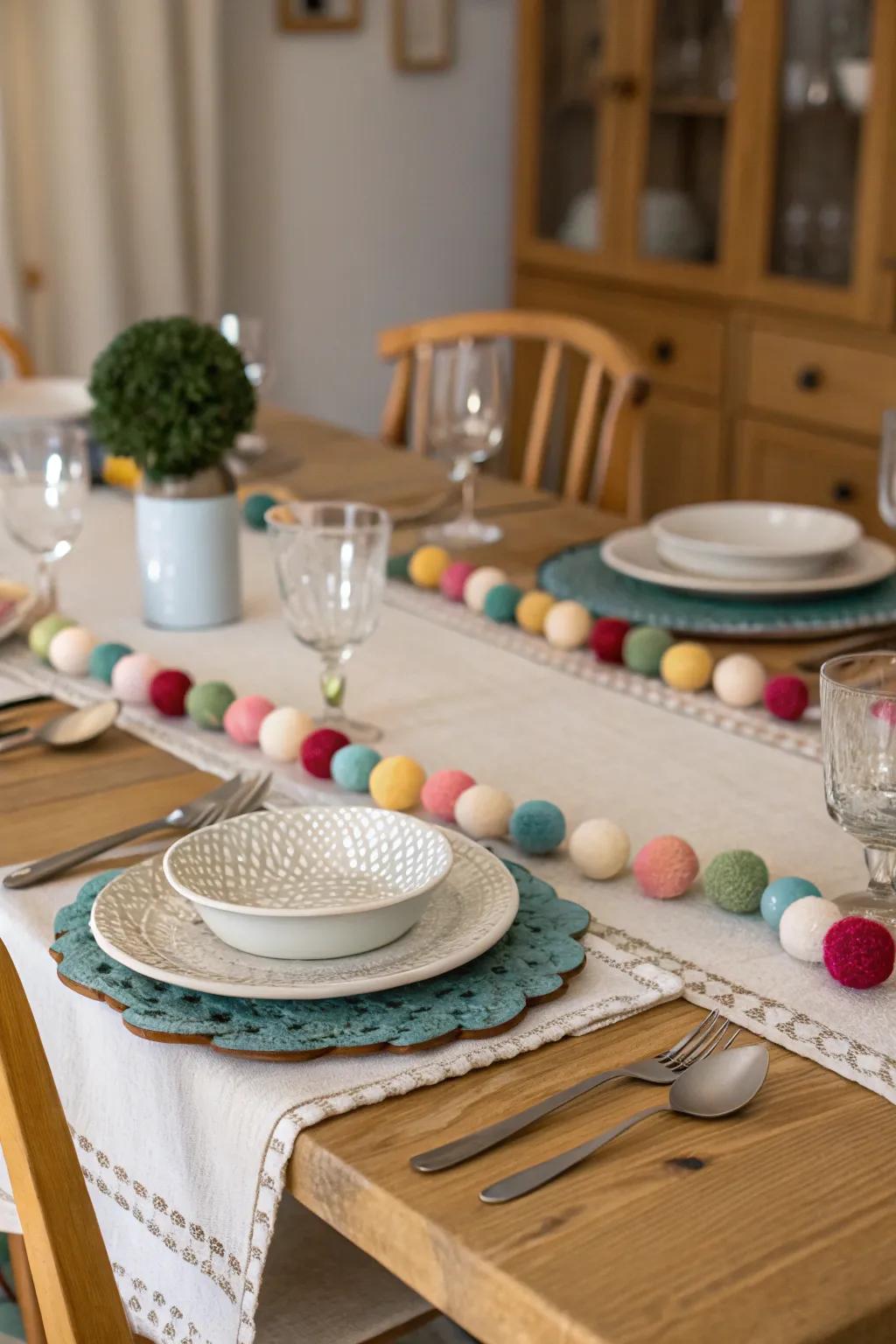 Felt garlands employed as table runners fashion a striking centerpiece for meals.