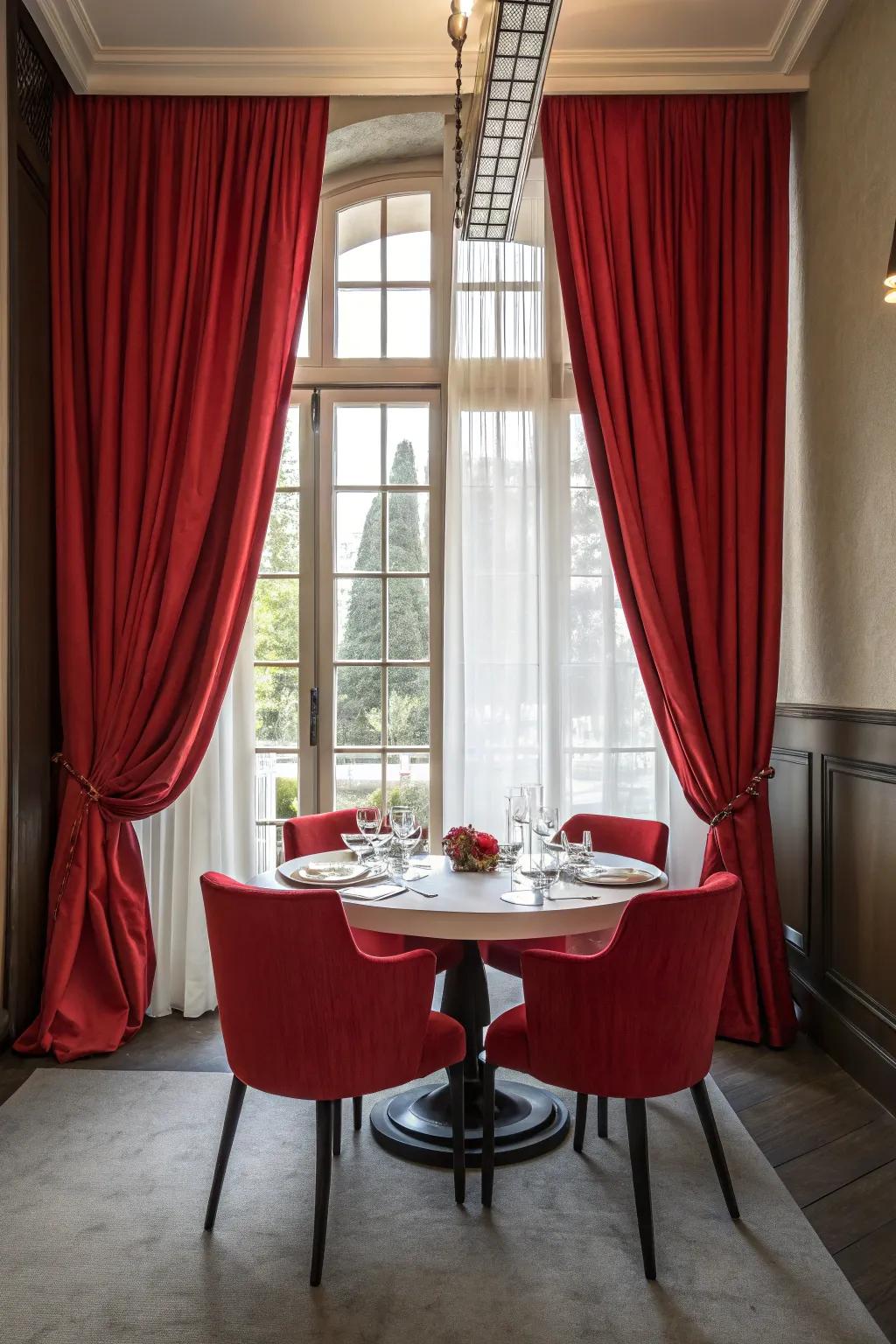 Bold red drapes include drama and individuality to this dining room.