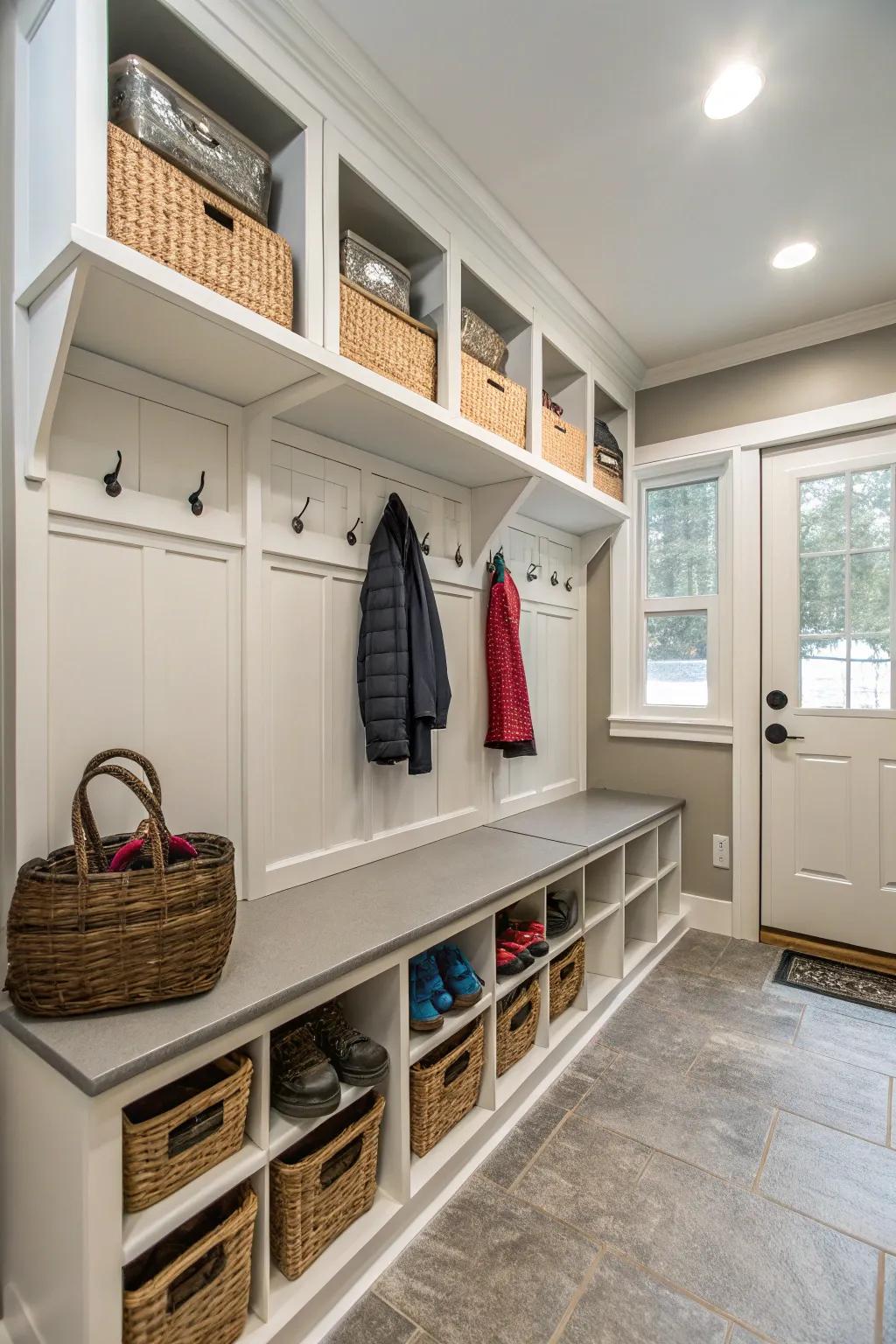 A functional mudroom featuring storage benches and coat hooks, helping keep the home organized.