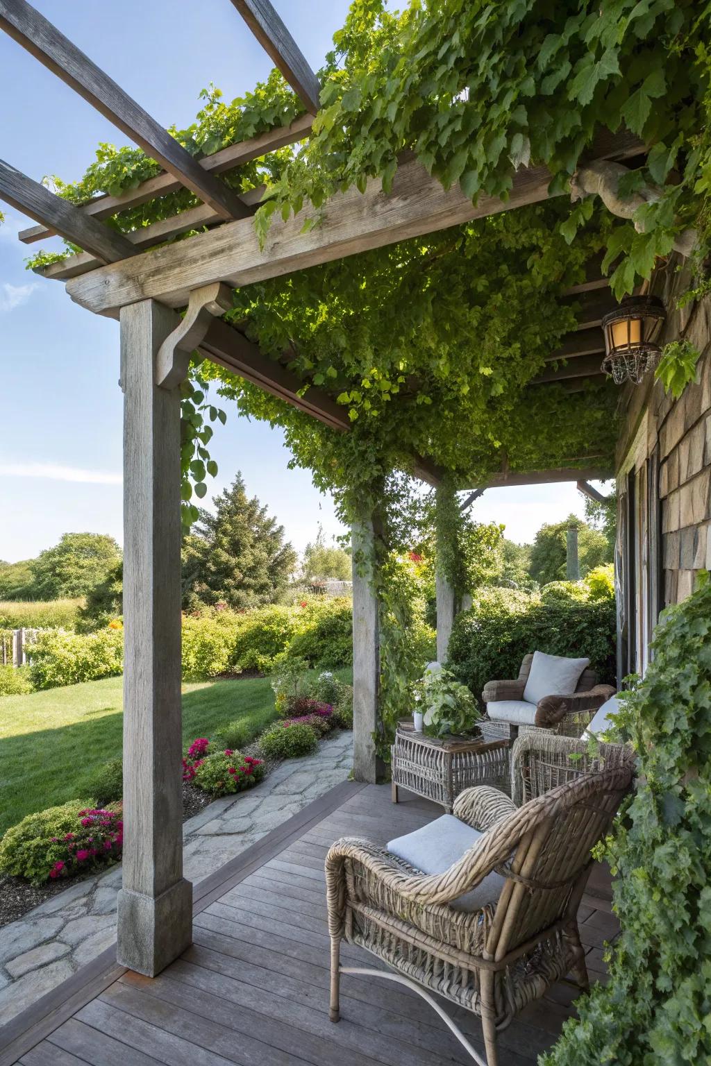 A wooden pergola offers shade and style to this outdoor porch.