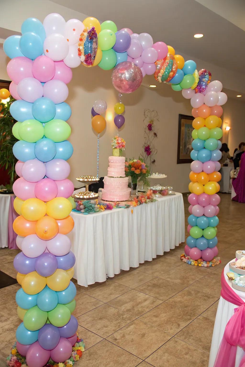 Balloon pillars elegantly frame the dessert presentation.