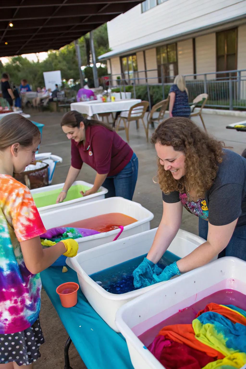 Attendees relishing a dyeing station, fashioning distinctive spectrum designs.