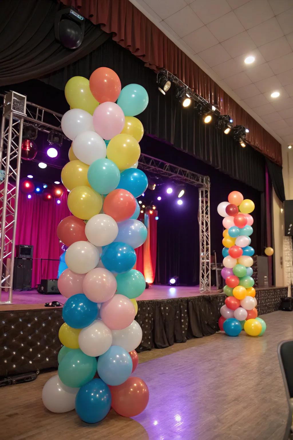 A vibrant stage arrangement with balloons of fluctuating dimensions and hues.