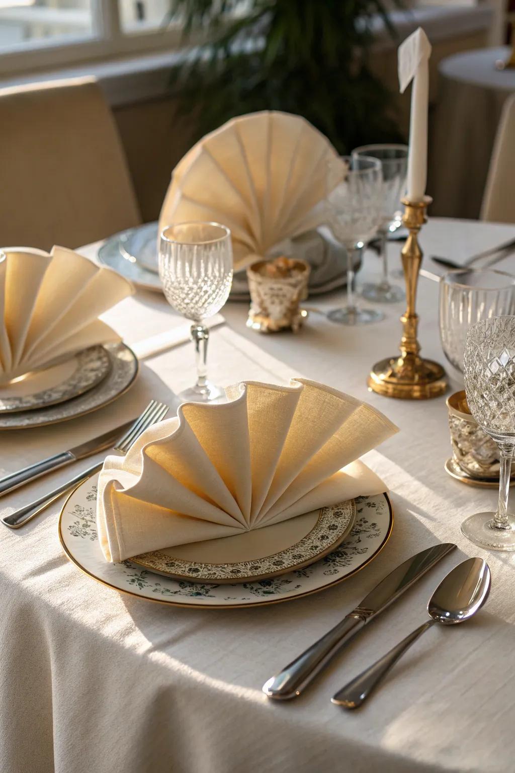 Fan-folded napkins embody timeless elegance at your Thanksgiving feast.