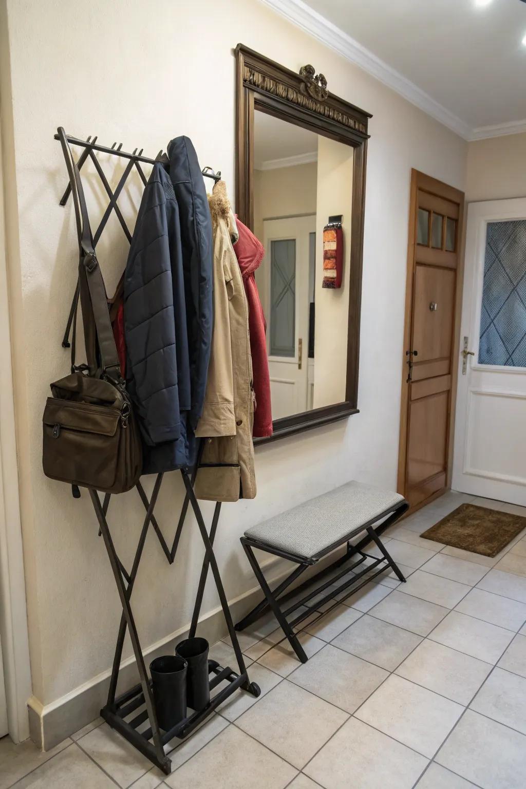 A foldable coat rack optimal for maximizing space within a petite entryway.