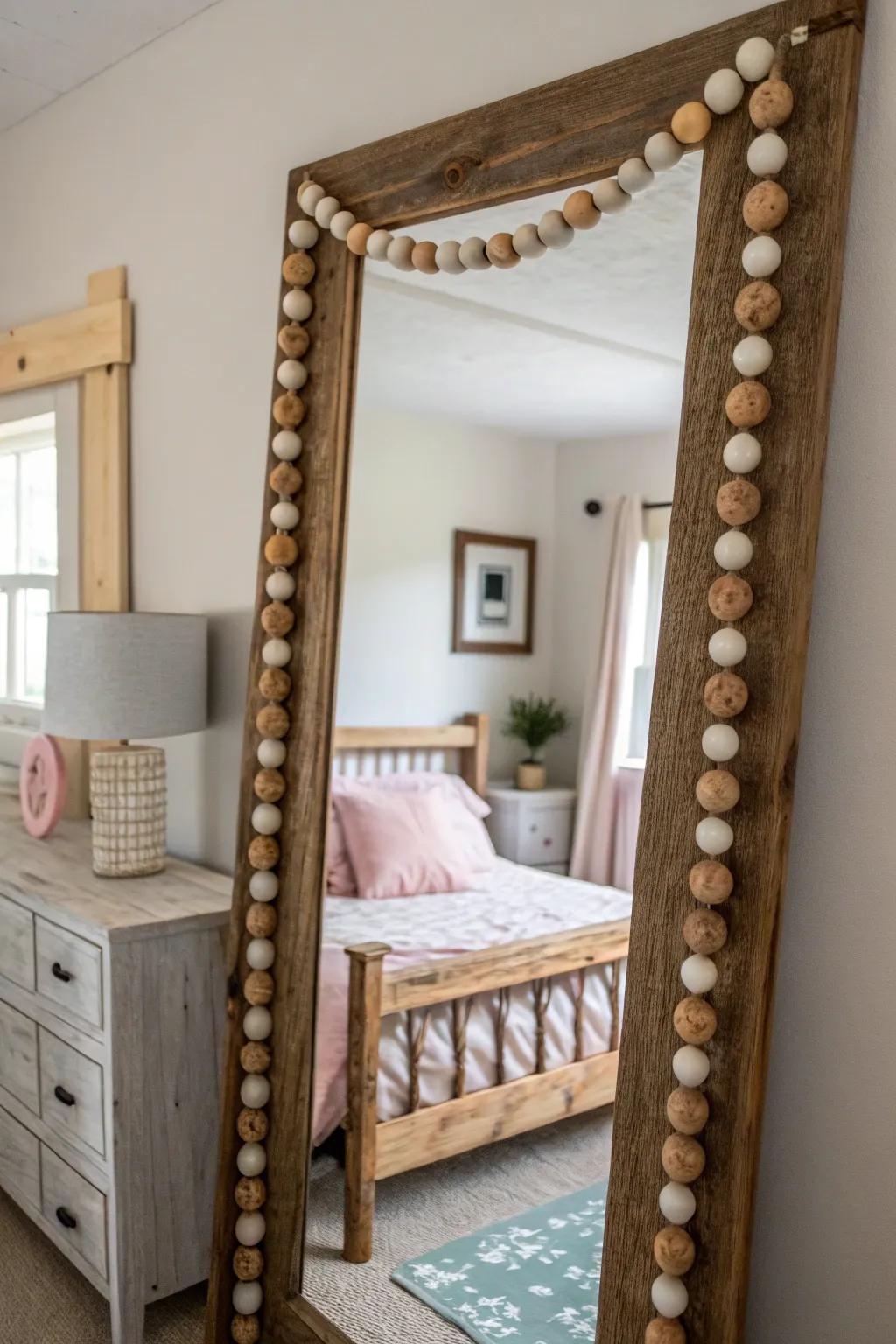 Mirror beautifully framed with wood bead garland.