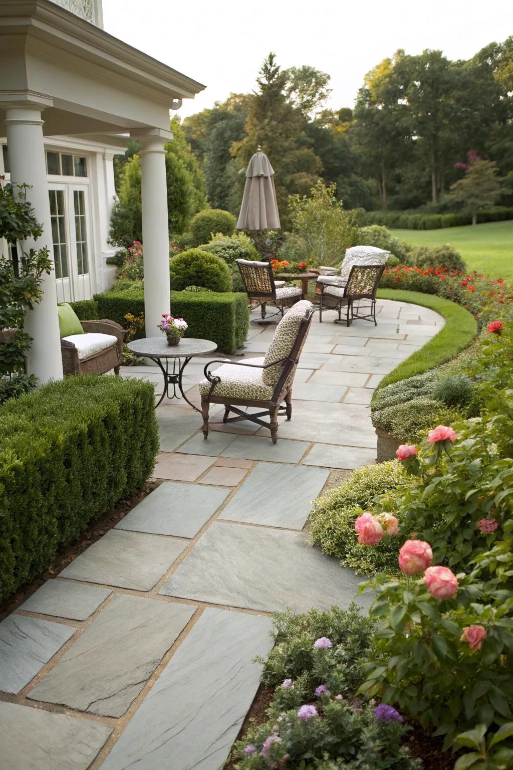 A sandstone pathway seamlessly interfacing with a snug outdoor living space.