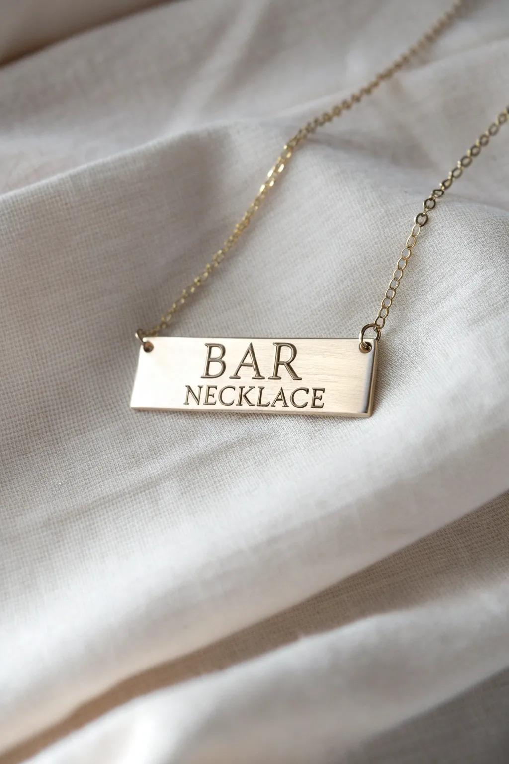 A contemporary plaque necklace with custom inscriptions.