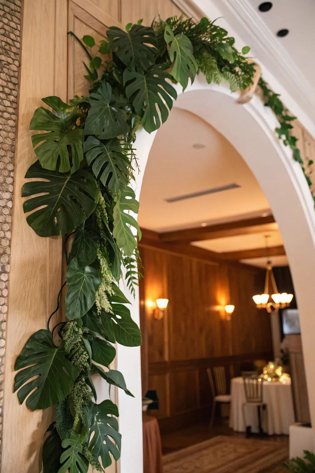 A lavish festoon of split-leaf philodendron fronds accentuating an archway.